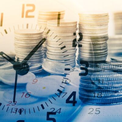 double exposure of rows of coins and calendar with clock for business and finance background